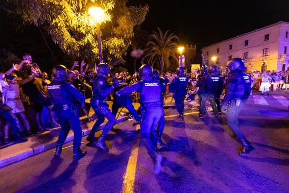 Hundreds protest after clashes at anti-mass tourism march in holiday spot loved by Brits