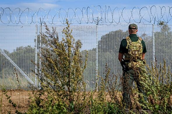 15 migrants caught climbing out of secret 10m tunnel in 'hybrid threat'
