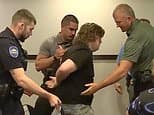 Midwest teacher, 37, is arrested for CLAPPING at public meeting about data centers