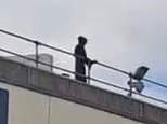 Man who climbed onto hospital roof dressed as the Grim Reaper and glared at visitors is fined