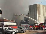 Homes evacuated and major incident declared as fire breaks out at showroom