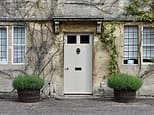 We've inherited half a house from our father but his partner still lives there - what are our options?