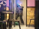Boy, 13, seriously injured after being stabbed at Taco Bell in Rochdale 'when 25 youths ran in with knives'