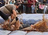 Got beef! Competitors meat out punishment as they battle for the World Gravy Wrestling Championships