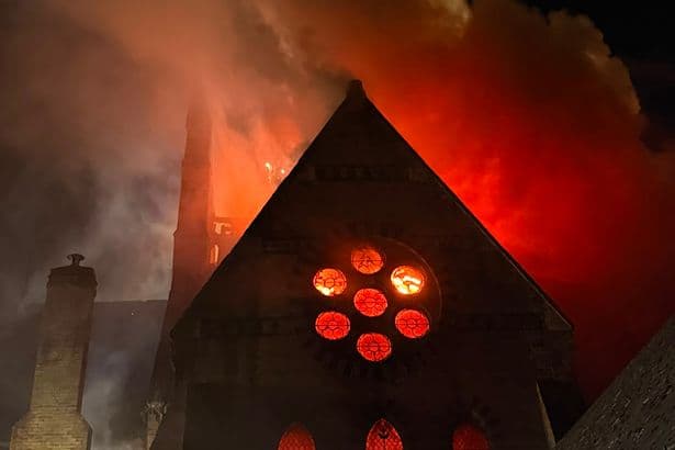 Flames tear through historic UK church as smoke blankets city centre