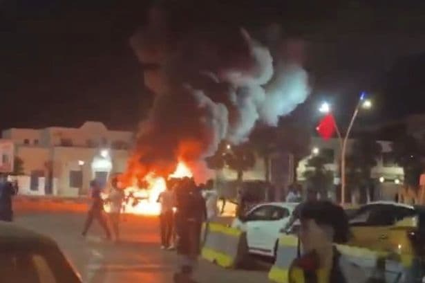 Spanish border crisis as riot erupts with cars on fire after thousands of migrants storm Melilla
