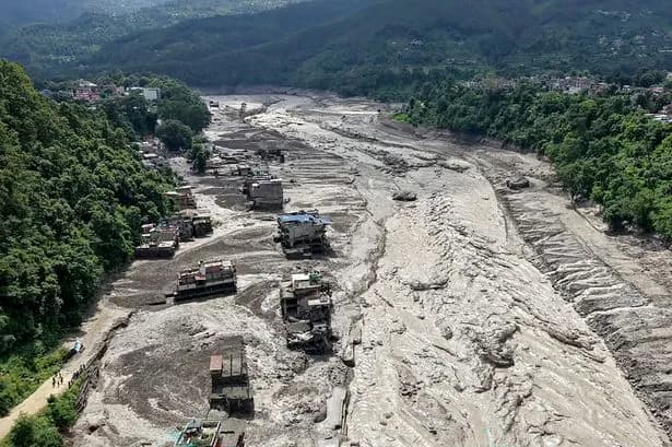 Nepal floods teacher saves more than 1,600 lives with alarm calls as death toll tops 700 and thousands missing