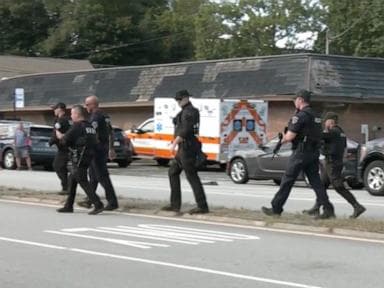 Possibly armed woman wanted in connection with off-duty officer death