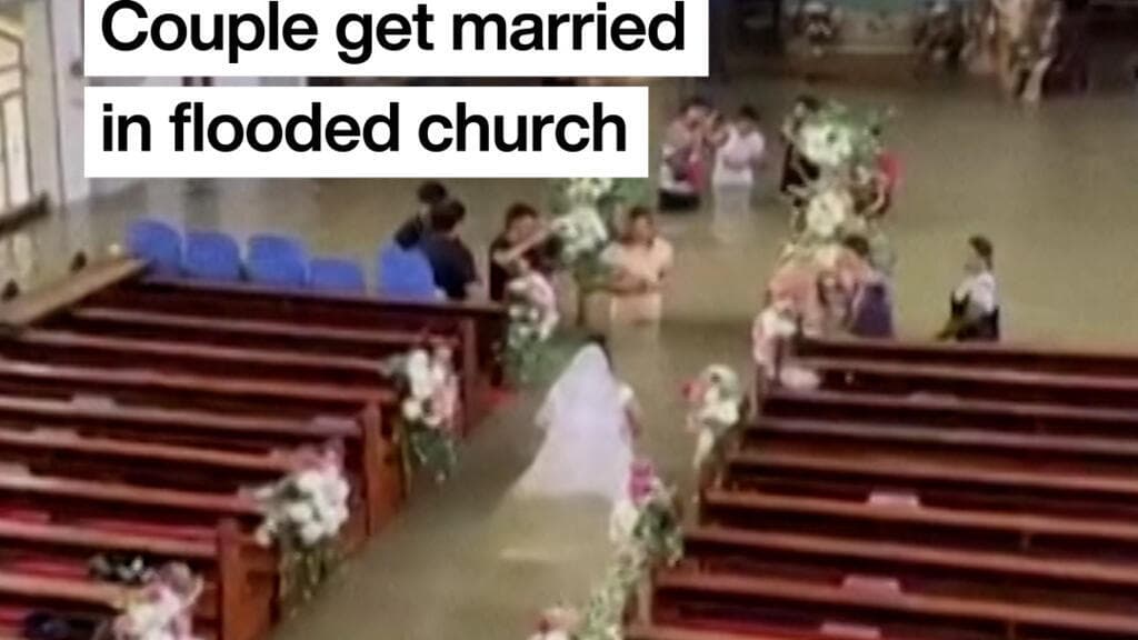 Philippine couple married in hip-deep floodwaters