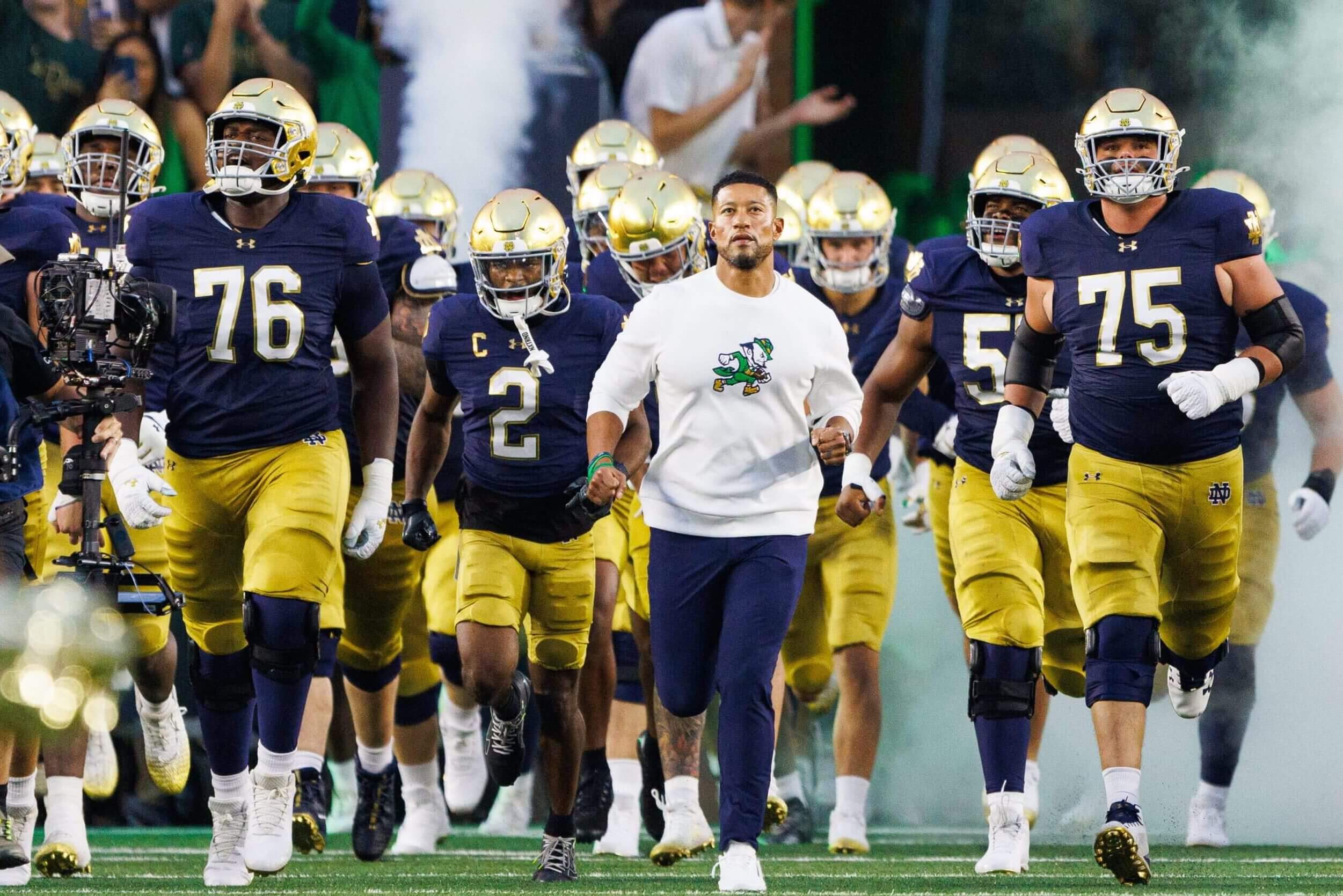 Why are college football programs suddenly putting corporate patches on their uniforms?