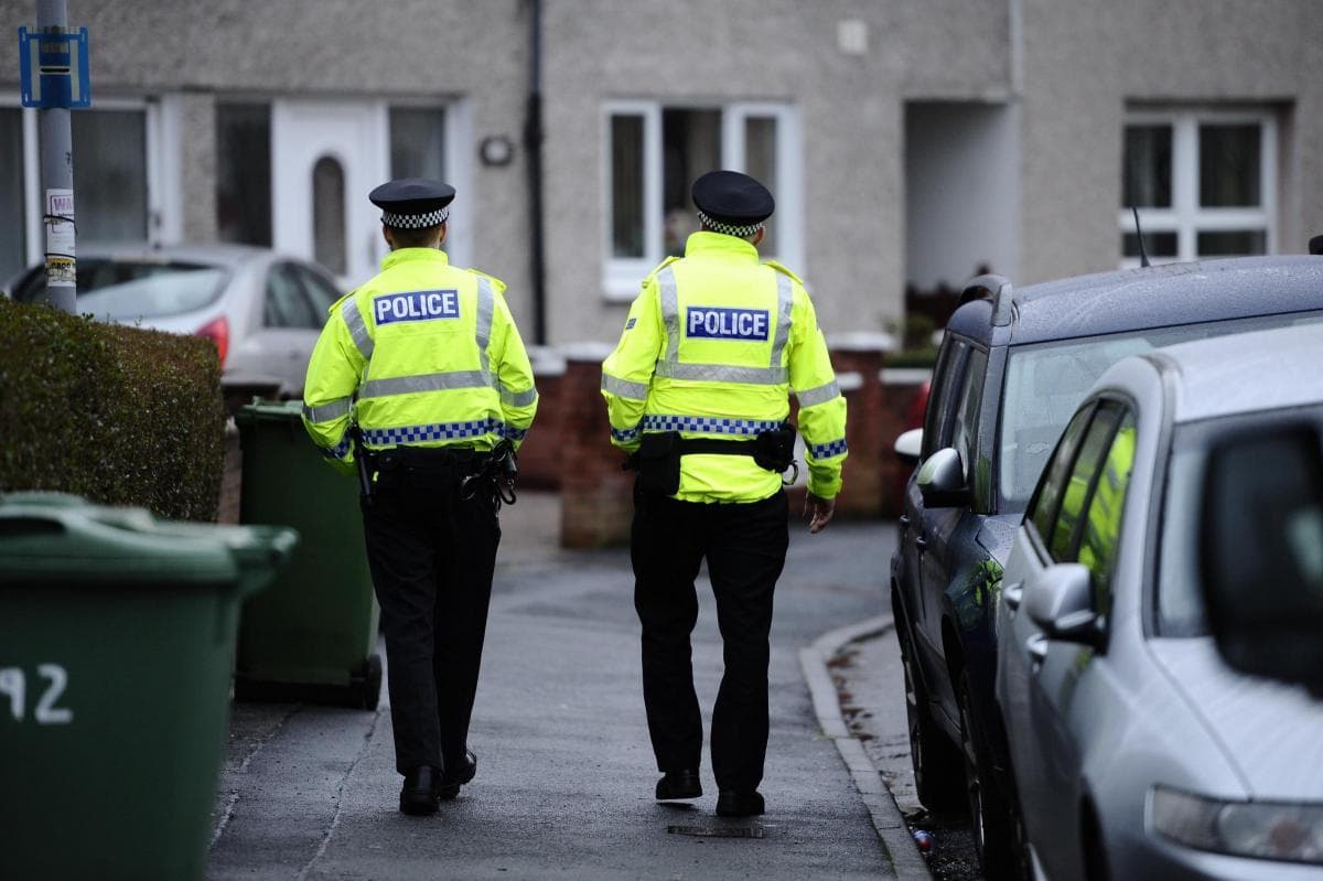 Police probe after two mend found 'dead with serious injuries' in Glasgow flat