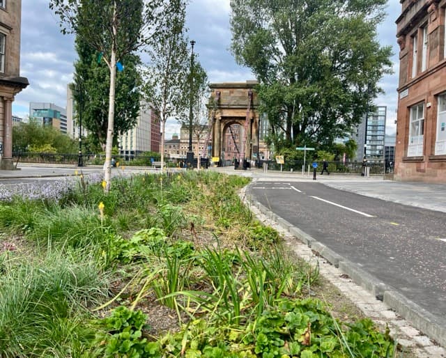 Glasgow street transformed with CCTV, cycle lanes and rain gardens by Clyde
