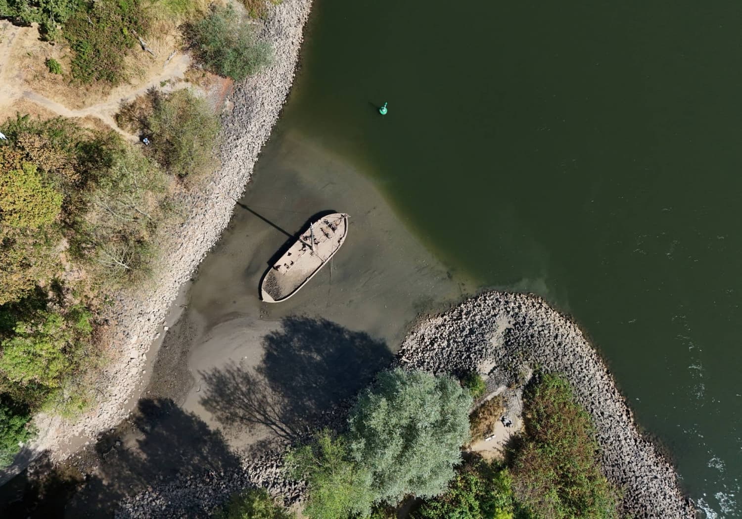 Low water levels on Germany’s Rhine amid heat and drought threaten economic blow
