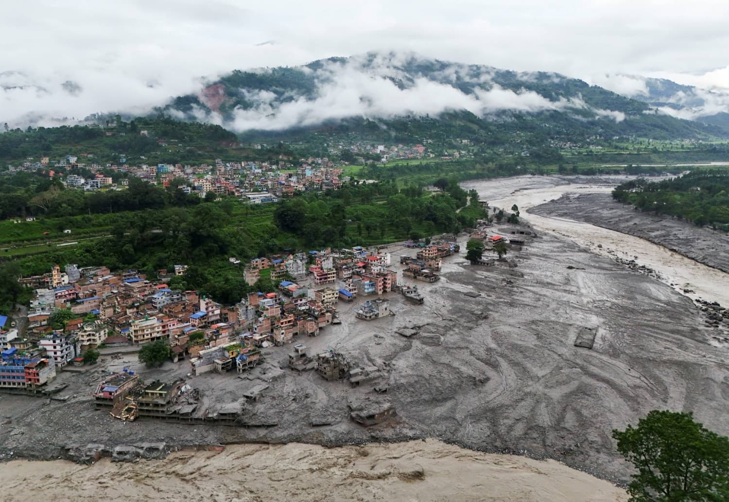 Rescuers seek nearly 1,500 still missing in Nepal and China after flash flood