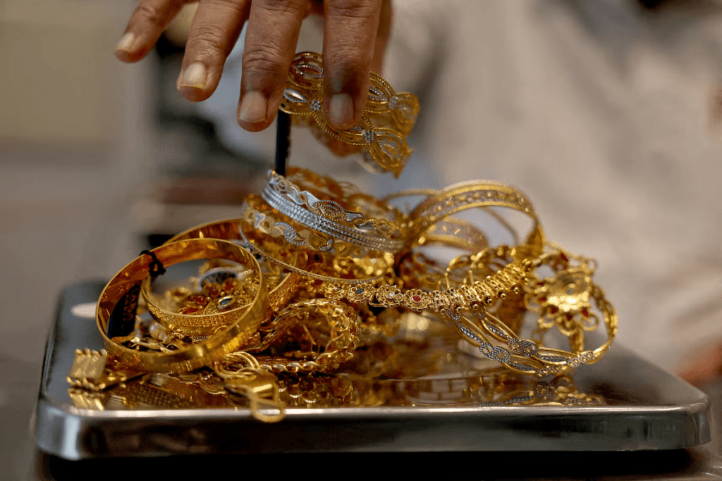 Gold Gains as Easing Fed Hike Expectations Pressure Dollar - WSJ