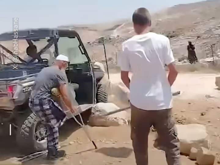 Evil Israeli land thief uses iron bar to attack Palestinian amputee