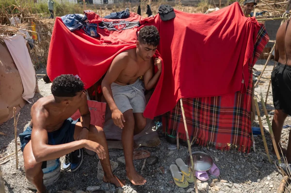 Spanish authorities begin relocating migrants from Ceuta beach to temporary shelters