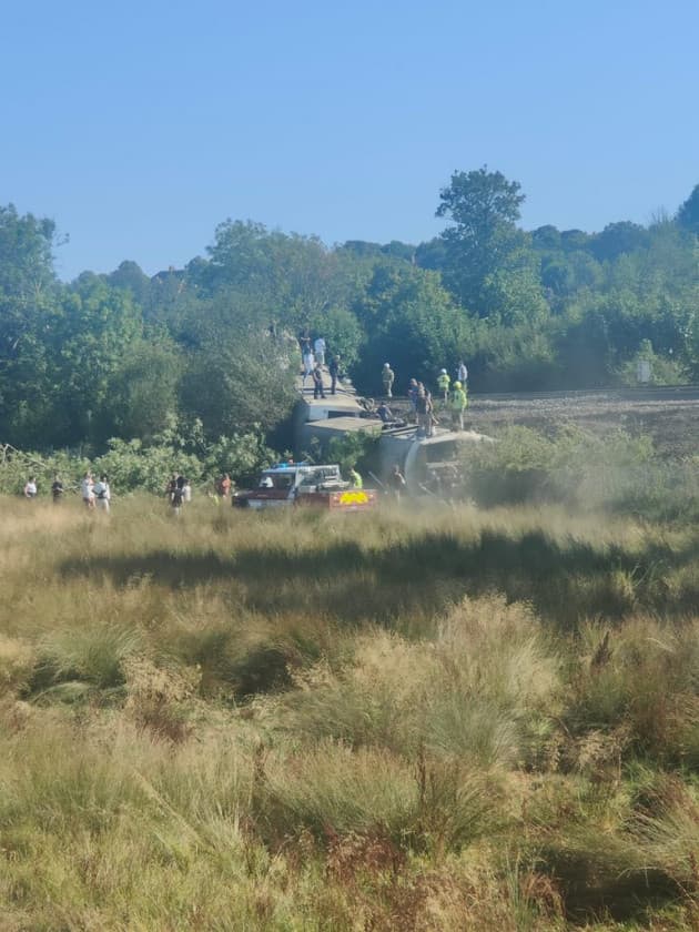 Two people seriously injured after train with 150 people derailed in East Sussex