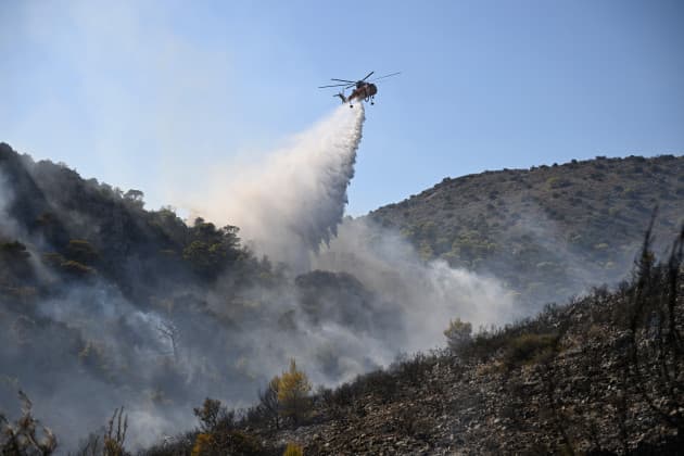 Two dead and hundreds evacuated after wildfires on Greek island