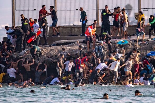 'Legal loophole' exposed after migrant surge leaves Spanish enclave in chaos