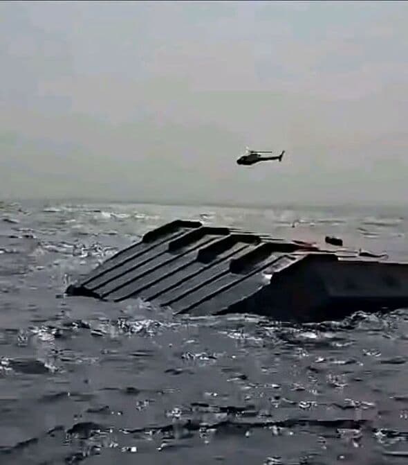 At least 15 dead and more missing after ferry capsizes on huge lake filled with crocodiles