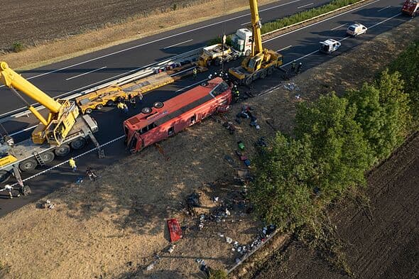 At least 12 die as tourist bus flips near Budapest sparking huge rescue operation