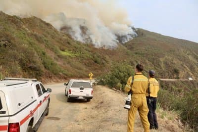 Quickly spreading wildfires trigger evacuations along Calif. coast