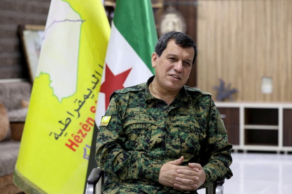 Kurdish-led group in Syria says it has dissolved after merging with the army