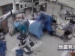 Moment Japanese surgeons cling to patient in operating theatre as 7.1 magnitude earthquake hits