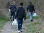 Charity hands migrants thousands of free SIM cards with six months of data, Ramadan food packs and haircuts
