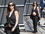 Pregnant Anne Hathaway flashes baby bump at Jimmy Kimmel after addressing speculation that she faked baby bump