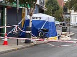 One woman is dead and another in hospital after being stabbed on London street: Man, 48, is arrested