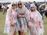 Festivalgoers brave the rain as Met Office issues new weather warning for thunderstorms and heavy showers