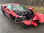 Ferrari supercar is wrecked after driver 'lost control' on motorway... but miraculously escapes unharmed