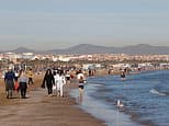 Woman, 22, is 'raped by illegal migrant on Spanish beach' after she went for an early morning swim