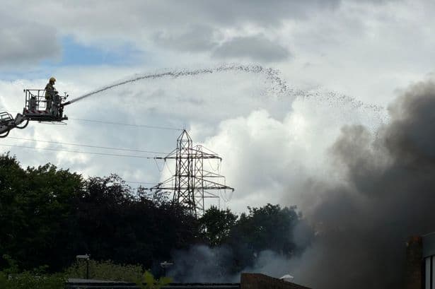 Dozens of firefighters tackle major Washington factory fire with black smoke seen for miles