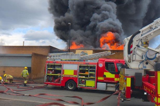 Workers run to escape horror fire tearing through Washington factory before huge explosion