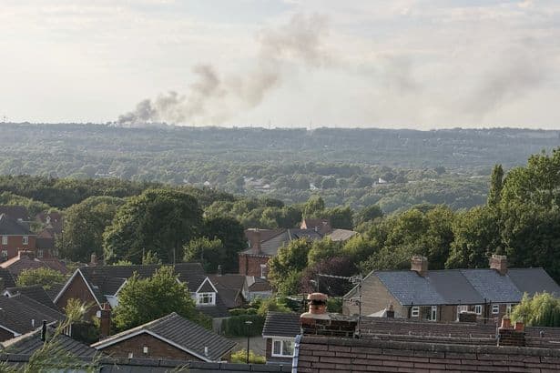 Photos of firefighters battling Washington fire at industrial estate with huge plumes of smoke