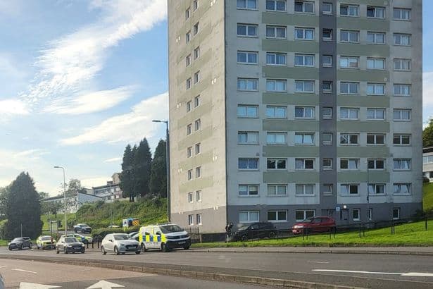 Man rushed to hospital with serious injuries as police remain at high-rise flats