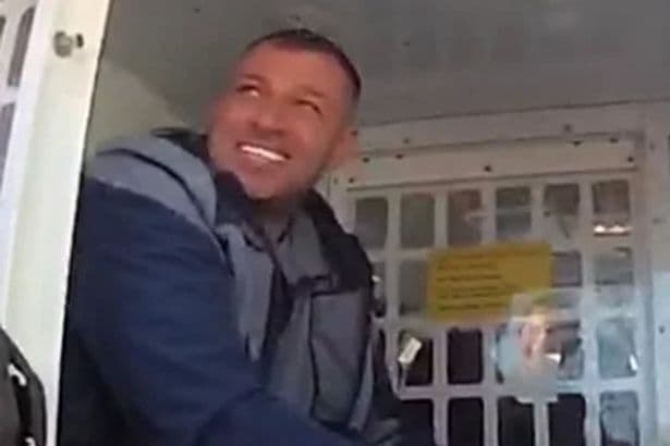 Scarface drug dealer who fled to Scotland pictured grinning in cop van after he's snared in Thailand