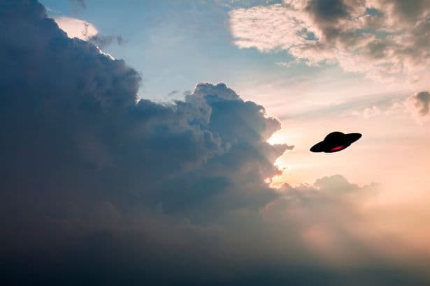 Mystery 'flying saucer' zooms within feet of passenger jet over UK airport