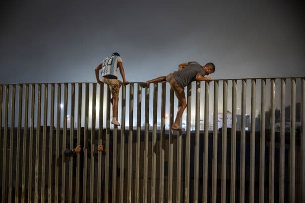 Border chaos as 18 dead after 50,000 migrants smash barriers and force locals to flee in fear