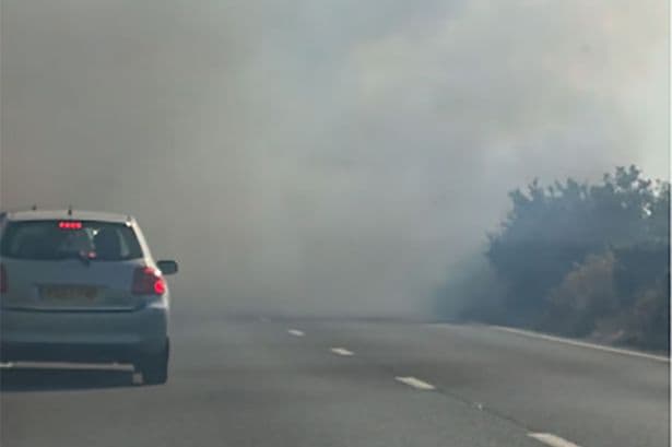 BREAKING Fire on major UK road as drivers told 'flee for your life' but some 'drive through flames'
