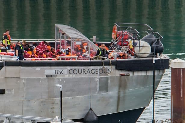 Moment migrants escorted back to UK after mega-dinghy nearly collapses with 230 on board