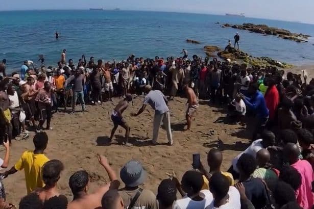Bare-chested migrants hold wrestling match on Ceuta beach weeks after mass border crossing