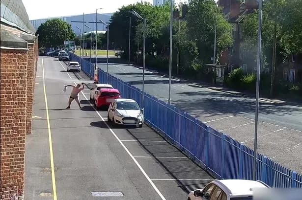 Moment topless bloke repeatedly fails to chuck £12,000 of drugs over prison wall
