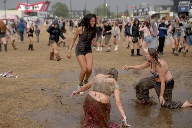 Reading Festival drenched in pouring rain as second day kicks off in total mudbath