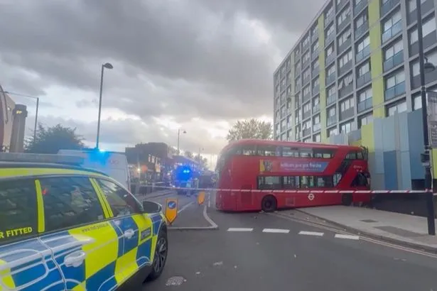 Double-decker bus veers off road, 'clips pedestrian' and smashes into building