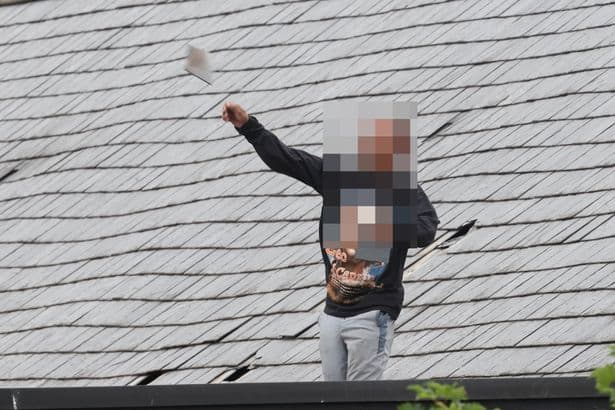 Man wearing Leonardo DiCaprio jumper launches tiles off roof in 40 hour police stand-off