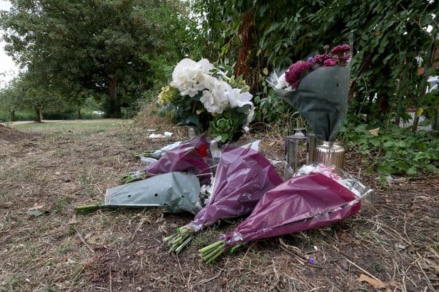 Floral tributes placed at Levenshulme murder scene as police issue arrest update